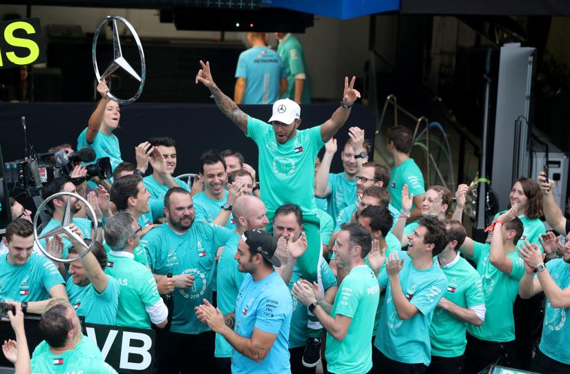 Brazilian Grand Prix - Sao Paulo, Brazil - Nov 11, 2018 Mercedes` Lewis Hamilton and team members celebrate after winning the constructors championship REUTERS