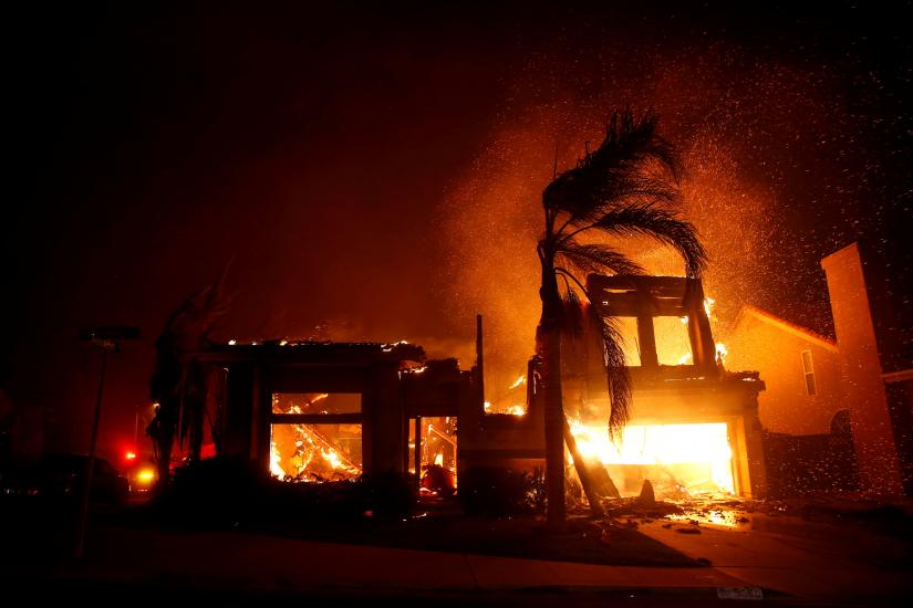 A home burns during a wildfire that claimed dozens of homes in Thousand Oaks, California, U.S. November 9, 2018. REUTERS