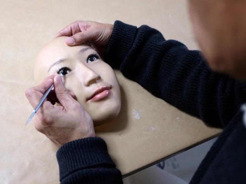 REAL-f Co. President Osamu Kitagawa creates a super-realistic face mask at his factory in Otsu, western Japan, November 15, 2018. REUTERS