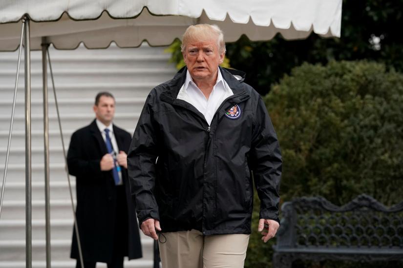 U.S. President Donald Trump walks out from the White House in Washington, U.S., before his departure to California, November 17, 2018. REUTERS