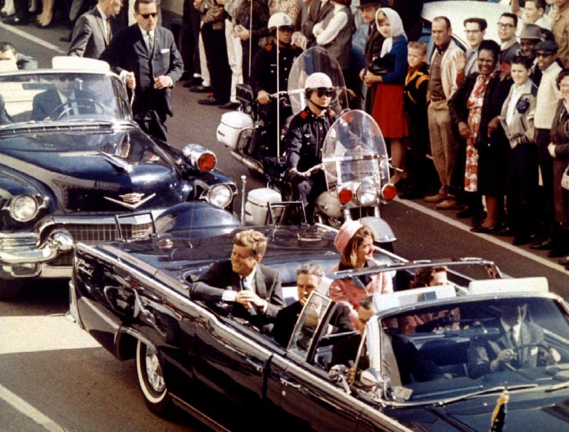US President John F Kennedy, First Lady Jaqueline Kennedy and Texas Governor John Connally ride in a liousine moments before Kennedy was assassinated, in Dallas, Texas November 22, 1963. Walt Cisco/Dallas Morning News/Handout/File Photo via REUTERS