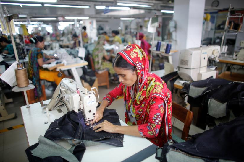 A worker works in a garment factory in Savar June 10, 2014. REUTERS/file photo