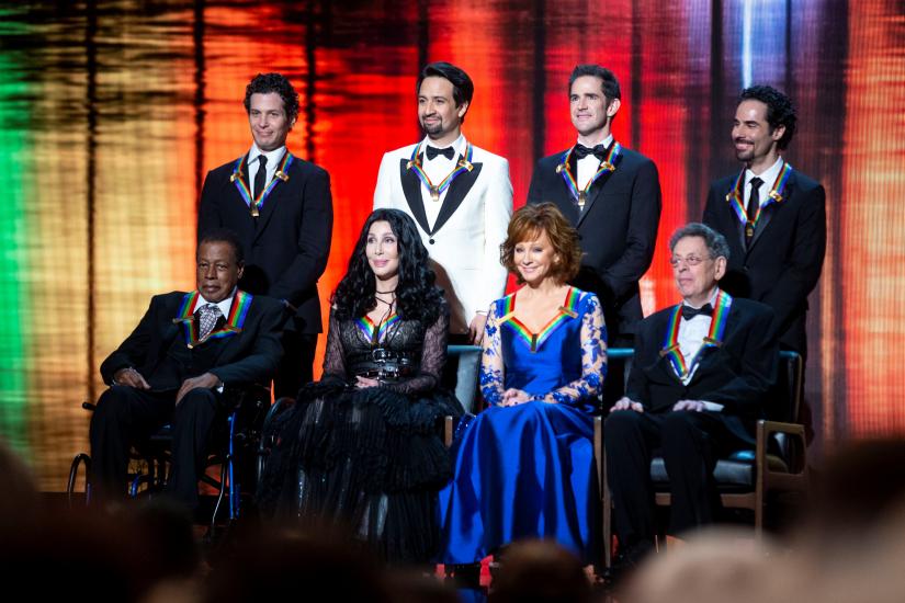 2018 Kennedy Center honorees, back row from left, the co-creators of 'Hamilton,' Thomas Kail, Lin-Manuel Miranda, Andy Blankenbuehler and Alex Lacamoire; and front row from left, Wayne Shorter, Cher, Reba McEntire, and Philip Glass appear on stage during the 41st Annual Kennedy Center Honors at The Kennedy Center in Washington, US, December 2, 2018. REUTERS