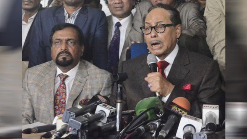 This undated photo shows Jatiya Party chief HM Ershad (right), accompanied by then-JP secretary general ABM Ruhul Amin Howlader, speaks to media in Dhaka.