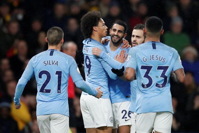 Manchester City`s Leroy Sane celebrates scoring their first goal with Riyad Mahrez and team mates against Watford at Vicarage Road, Watford, Britain on Dec 4, 2018. REUTERS
