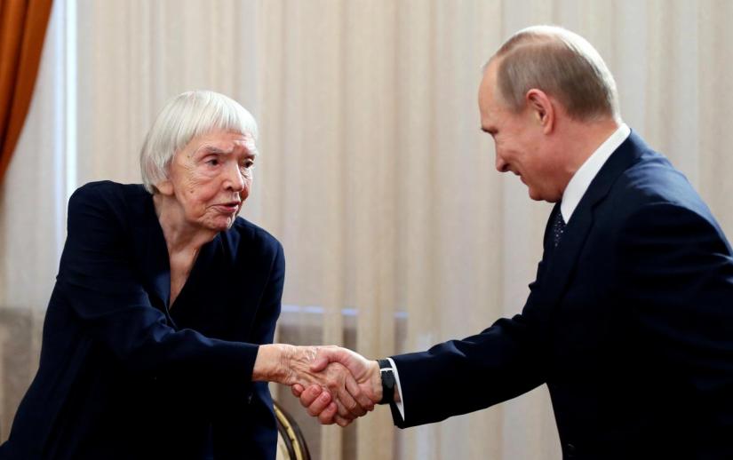 Russian President Vladimir Putin (R) shakes hands with Lyudmila Alexeyeva, the head of the Moscow Helsinki Group, before his meeting with Russian human rights activists in Novo-Ogaryovo residence outside Moscow January 23, 2014. REUTERS/FILE PHOTO