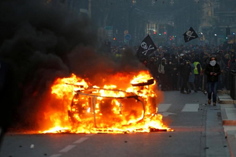 A car burns during during clashes with police at a demonstration of the `yellow vests` movement in Marseille, France, December 8, 2018. REUTERS