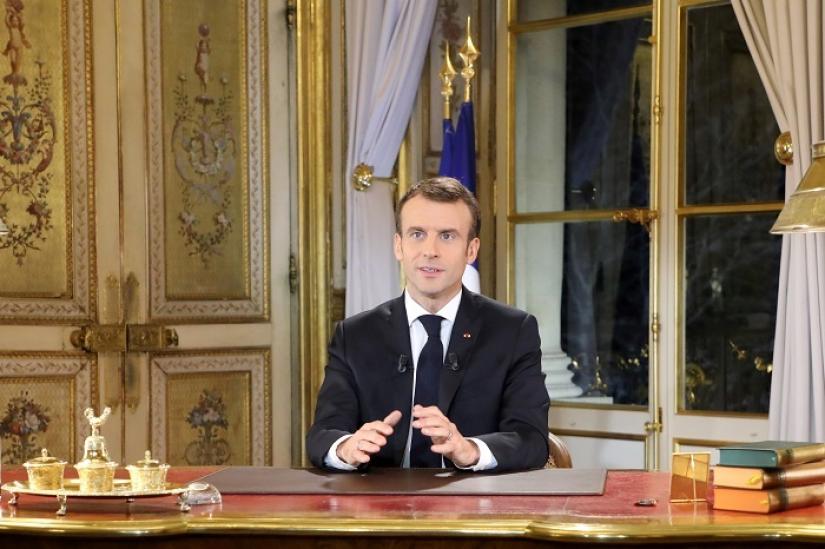 French President Emmanuel Macron speaks during a special address to the nation, his first public comments after four weeks of nationwide `yellow vest` (gilet jaune) protests, at the Elysee Palace, in Paris, France December 10, 2018. REUTERS