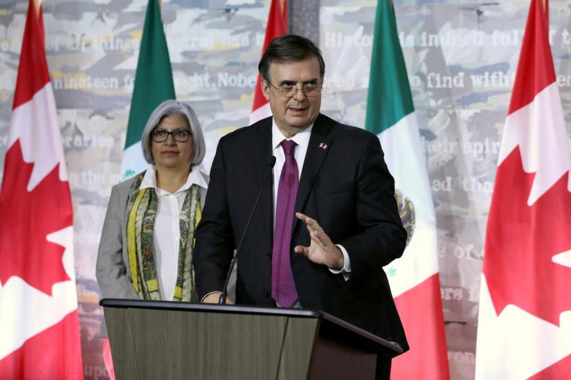 Incoming Mexican foreign minister Marcelo Ebrard speaks during a news conference as incoming Mexican economy minister Graciela Marquez looks on, in Ottawa, Ontario, Canada, October 22, 2018. REUTERS/FILE PHOTO