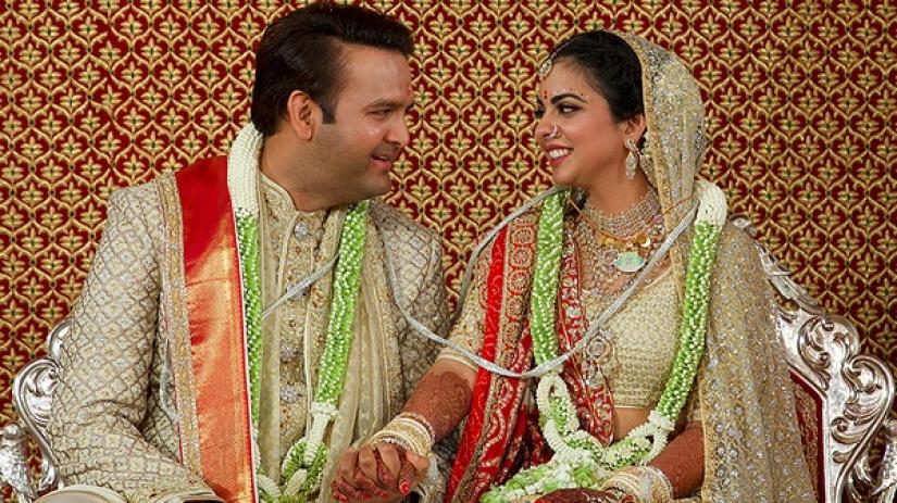 Bride Isha Ambani, the daughter of the Chairman of Reliance Industries Mukesh Ambani, and her groom Anand Piramal, heir to a real-estate and pharmaceutical business, after they got married in Mumbai, India, December 12, 2018. Reliance Industries/Handout via REUTERS
