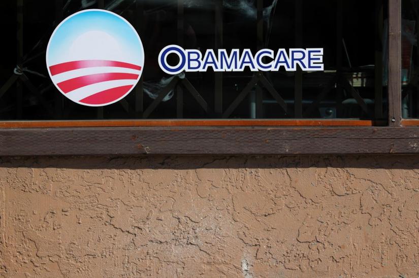 A sign on an insurance store advertises Obamacare in San Ysidro, San Diego, California, U.S., October 26, 2017. REUTERS