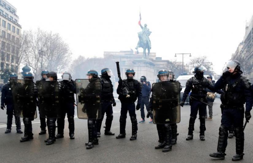 French riot police stand guard during a demonstration by the `yellow vests` movement in Paris, France, December 15, 2018. REUTERS
