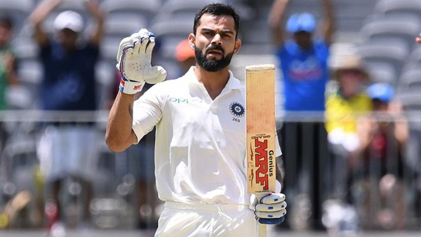 India`s captain Virat Kohli reacts after scoring his century on day three of the second test match between Australia and India at Perth Stadium in Perth, Australia, December 16, 2018. AAP/Dave Hunt/via REUTERS