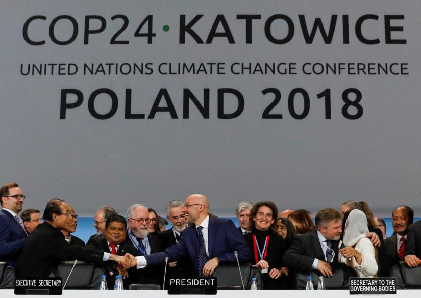 COP24 President Michal Kurtyka is greeted after adopting the final agreement during a closing session of the COP24 U.N. Climate Change Conference 2018 in Katowice, Poland, December 15, 2018. REUTERS