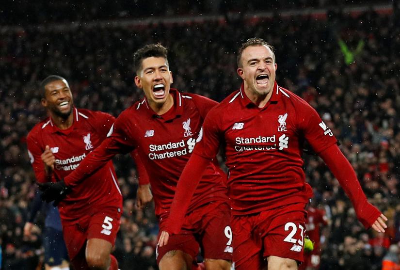 Liverpool`s Xherdan Shaqiri celebrates scoring their third goal with Roberto Firmino and Georginio Wijnaldum. December 16, 2018. REUTERS