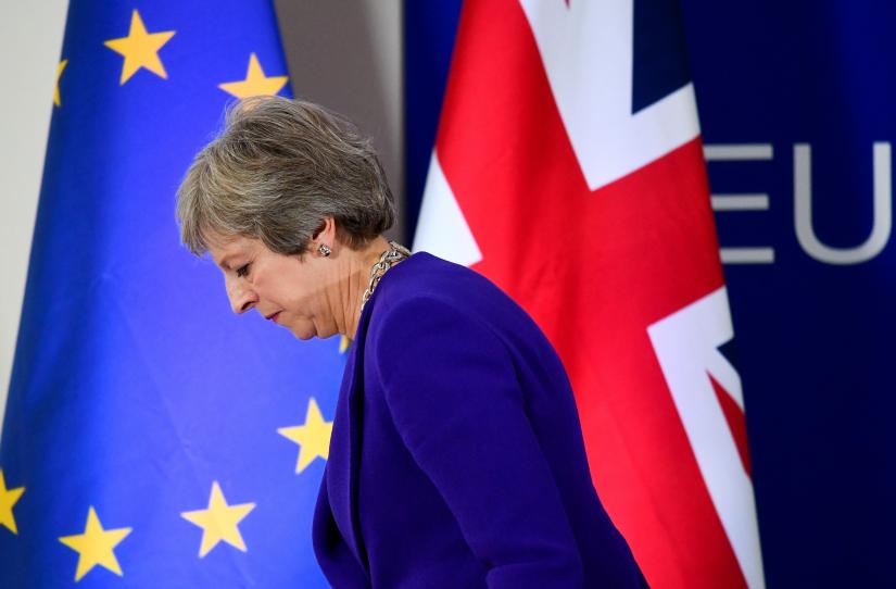Britain`s Prime Minister Theresa May leaves after a news conference at the European Union leaders summit in Brussels, Belgium. Oct. 18, 2018. REUTERS