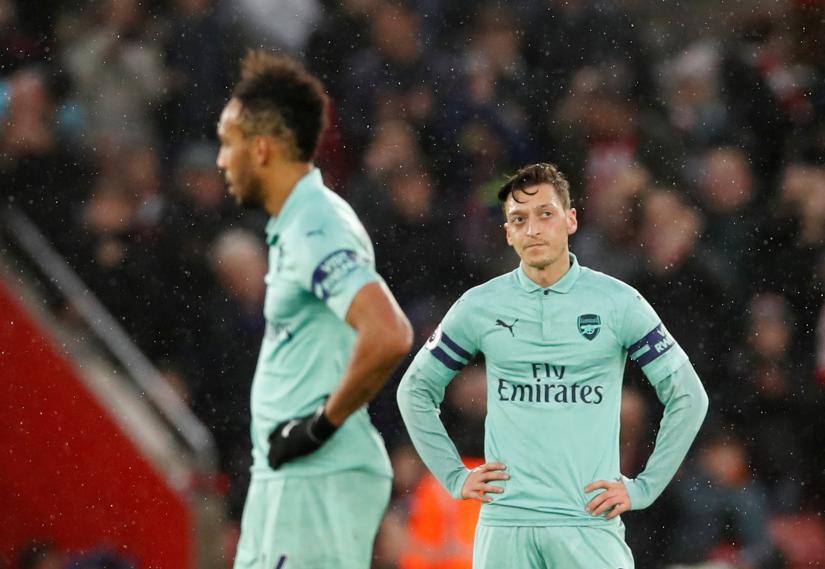 Arsenal`s Mesut Ozil and Pierre-Emerick Aubameyang look dejected after conceding their third goal scored by Southampton`s Charlie Austin (not pictured). December 16, 2018. REUTERS