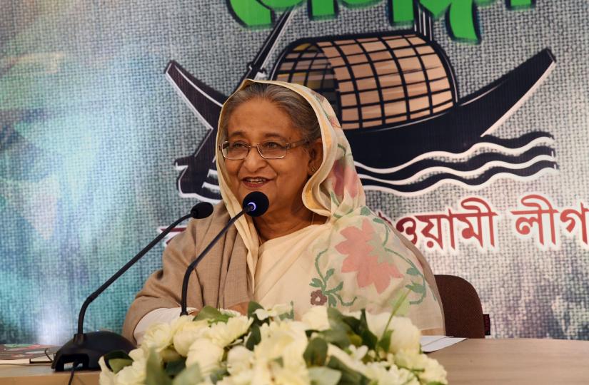 Prime Minister and Awami League President Sheikh Hasina addresses public rallies in Bandarban and Kishoreganj through videoconferencing from her Sudha Sadan residence at Dhanmondi in the capital on Tuesday (Dec 18). PID
