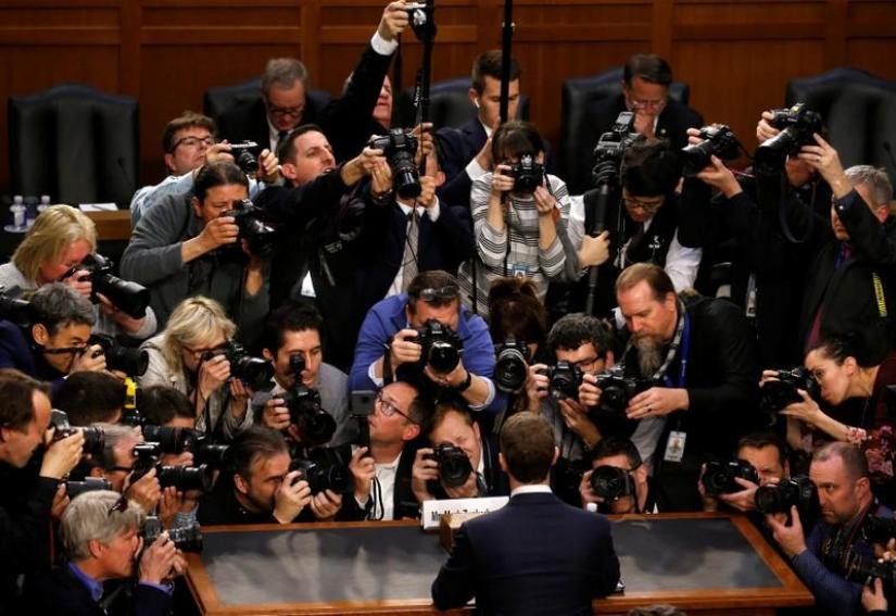 Facebook CEO Mark Zuckerberg is surrounded by members of the media as he arrives to testify before a Senate Judiciary and Commerce Committees joint hearing regarding the company’s use and protection of user data, on Capitol Hill in Washington, US, April 10, 2018. REUTERS