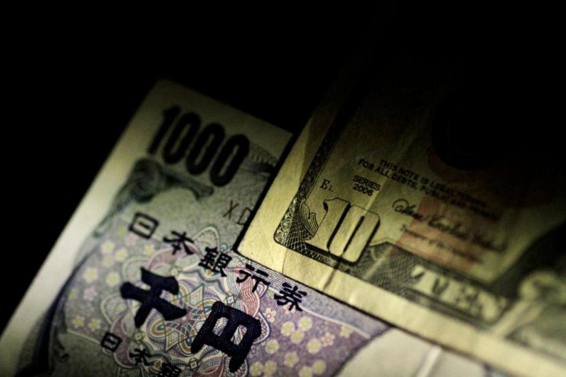 US Dollar and Japan Yen notes are seen in this June 22, 2017 illustration photo. REUTERS/FILE PHOTO
