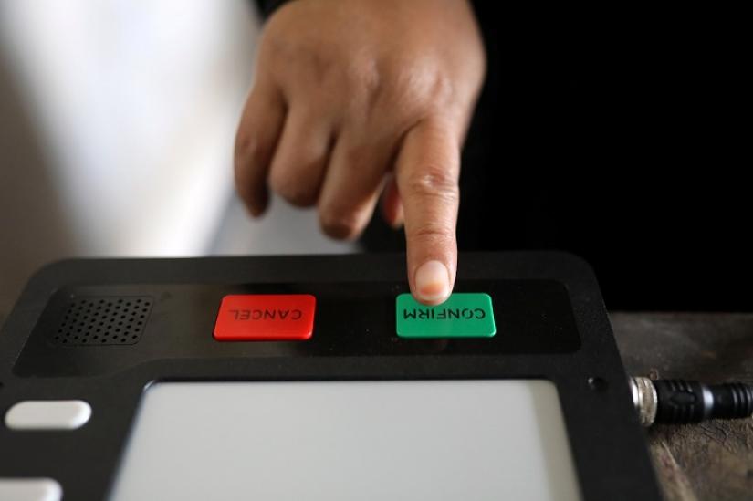 A woman casts her vote on an Electronic Voting Machine (EVM) during a day long mock voting test ahead of the 11th general election in Dhaka, Bangladesh, December 27, 2018. REUTERS