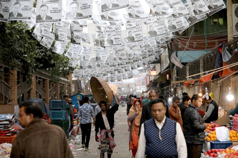 Posters of an election candidate are seen hanging above the street ahead of the 11th general election in Dhaka, Bangladesh, December 28, 2018. REUTERS
