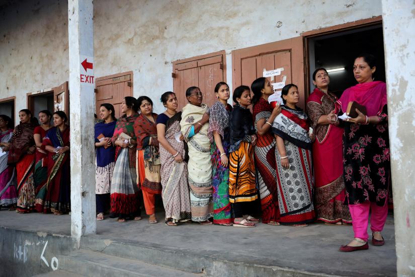 Hindu voters wait to cast their vote outside a voting center during the general election in Dhaka, Bangladesh December 30, 2018. REUTERS
