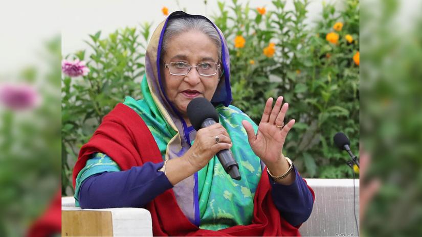 Prime Minister and Awami League chief Sheikh Hasina addresses foreign election observers and journalists at the prime minister’s official residence the Ganabhaban on Monday (Dec 31). FOCUS BANGLA