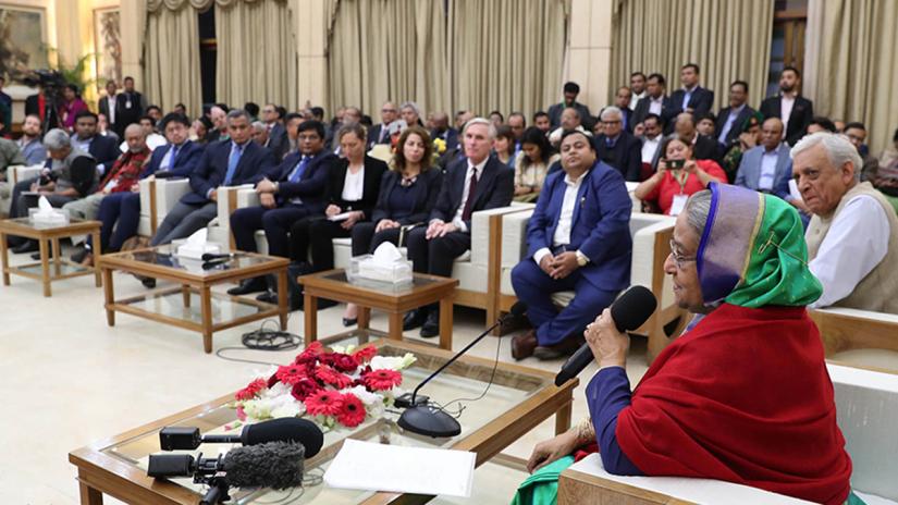 Awami League chief Sheikh Hasina addresses foreign observers and journalists at the prime minister’s official residence the Ganabhaban on Monday (Dec 31). FOCUS BANGLA