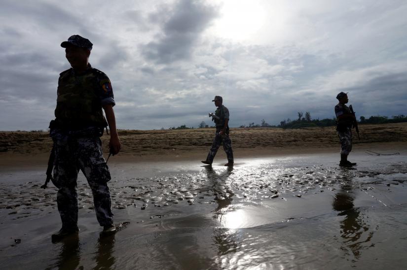 A Myanmar border guard police officers stand guard in Buthidaung, northern Rakhine state, Myanmar July 13, 2017. REUTERS/File Photo