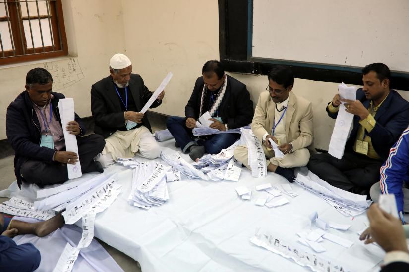 Presiding officers count votes at a voting center after the session has ended in Dhaka, Bangladesh, December 30, 2018. REUTERS