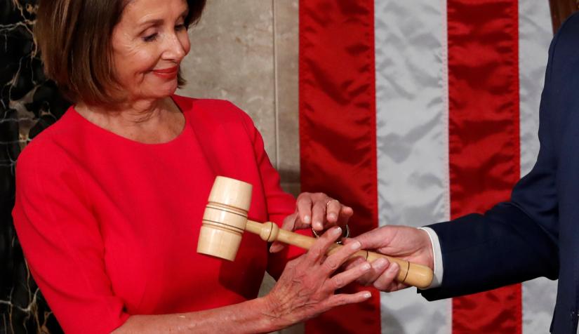 Nancy Pelosi (D-CA) receives the gavel from House Republican Leader Kevin McCarthy (R-CA) after being elected as Speaker of the House during the start of the 116th Congress in the Capitol in Washington, US, January 3, 2019. REUTERS