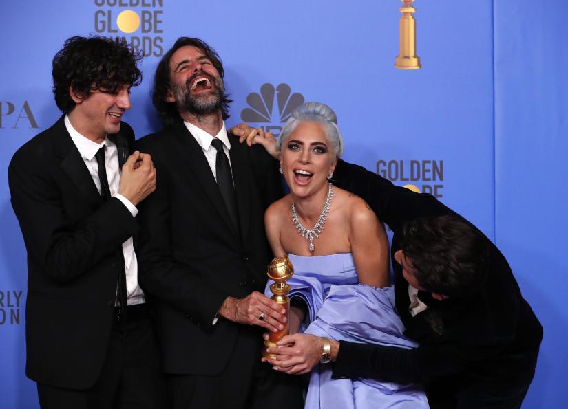 76th Golden Globe Awards - Photo Room - Beverly Hills, California, U.S., January 6, 2019 - (From L) Anthony Rossomando, Andrew Wyatt, Lady Gaga and Mark Ronson pose backstage with their Best Original Song Motion Picture award for `Shallow` from `A Star is Born.` REUTERS