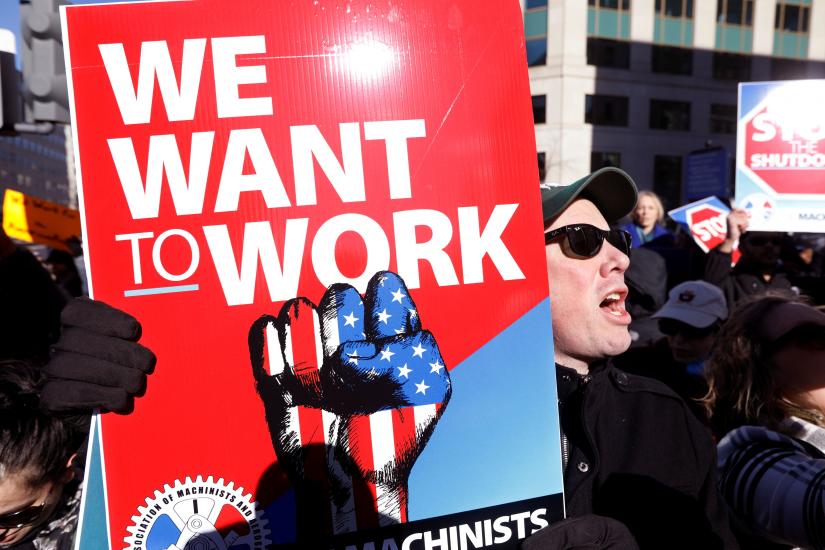 US federal government workers and other demonstrators march during a “Rally to End the Shutdown” in Washington, US, January 10, 2019. REUTERS