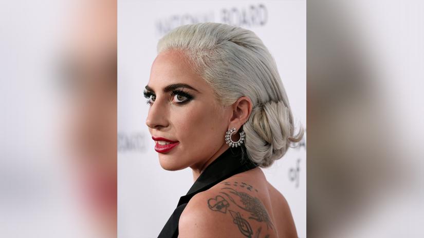Lady Gaga poses for photographers as she arrives for the National Board of Review Awards gala in New York City, New York, U.S., January 8, 2019. REUTERS