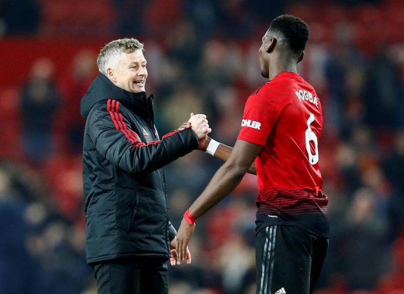 Manchester United`s Paul Pogba and interim manager Ole Gunnar Solskjaer after the match against Huddersfield Town on December 26, 2018. Action Images via Reuters/file photo