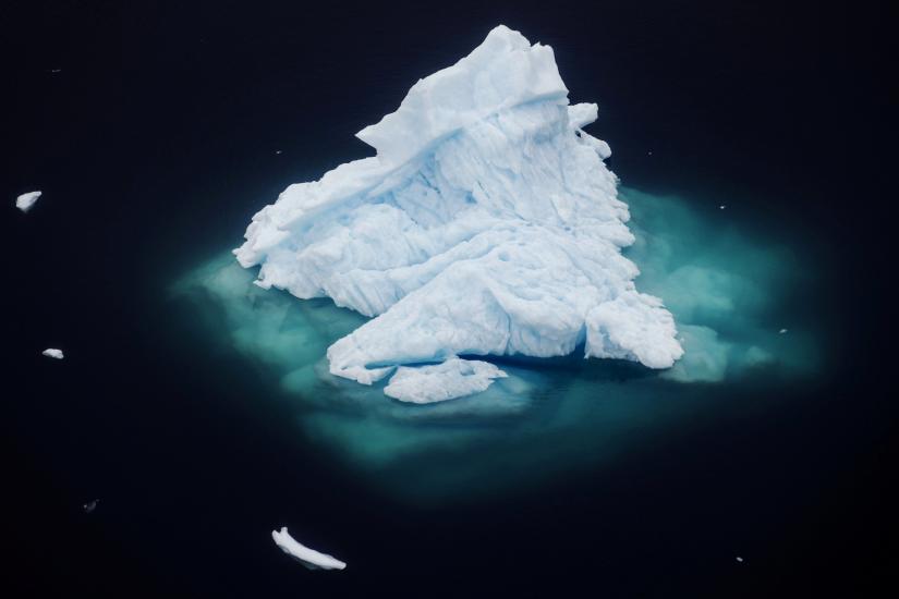 An iceberg floats in a fjord near the town of Tasiilaq, Greenland, June 24, 2018. REUTERS -- file photo