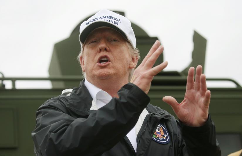 President Donald Trump talks to reporters as he visits the banks of the Rio Grande River during the president`s visit to the US - Mexico border in Mission, Texas, January 10, 2019. REUTERS