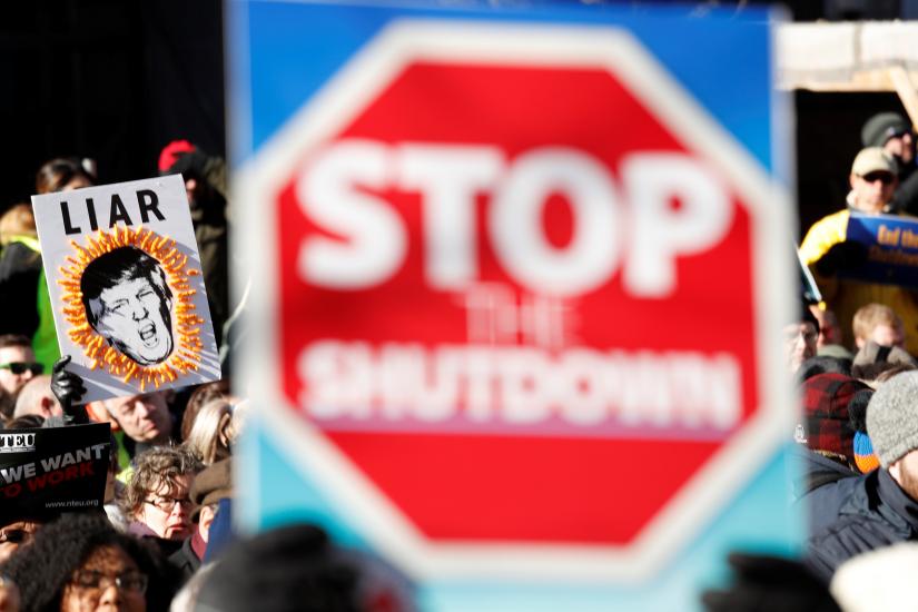 U.S. federal government workers and other demonstrators march during a “Rally to End the Shutdown” in Washington, U.S., January 10, 2019. REUTERS