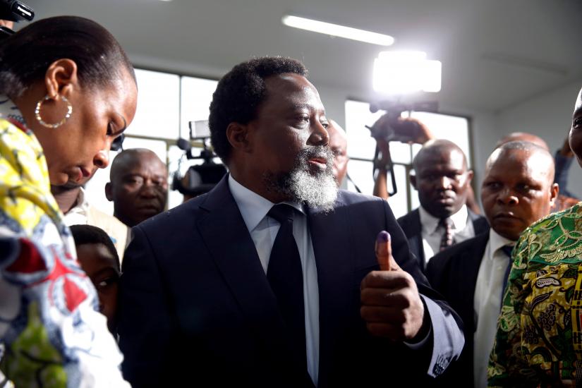Democratic Republic of Congo President Joseph Kabila displays ink on his hand after casting his vote at a polling station in Kinshasa, Democratic Republic of Congo, December 30, 2018. REUTERS/File Photo
