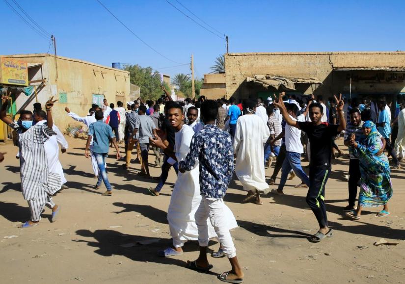 Sudanese demonstrators march along the street during anti-government protests after Friday prayers in Khartoum, Sudan January 11, 2019. REUTERS