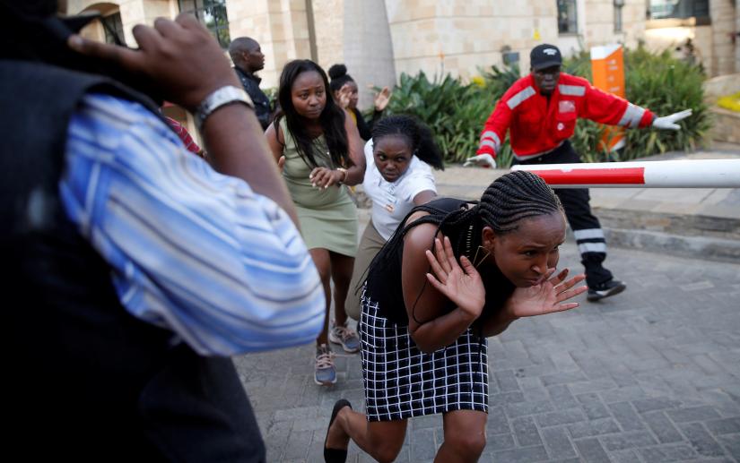 People run as they are evacuated at the scene where explosions and gunshots were heard at the Dusit hotel compound, in Nairobi, Kenya January 15, 2019. REUTERS