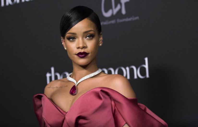Singer Rihanna poses at the First Annual Diamond Ball fundraising event at The Vineyard in Beverly Hills, California December 11, 2014. REUTERS