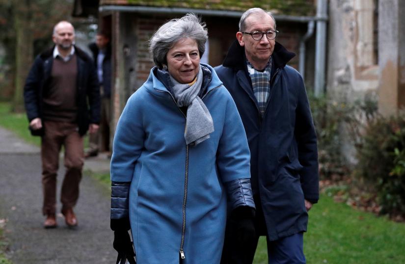 Britain`s Prime Minister Theresa May and her husband Philip leave church, near High Wycombe, Britain, January 13, 2019. REUTERS
