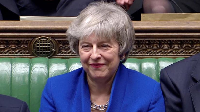British Prime Minister Theresa May reacts as Jeremy Corbyn speaks, after she won a confidence vote, after Parliament rejected her Brexit deal, in London, Britain, January 16, 2019, in this screen grab taken from video. Reuters TV via REUTERS