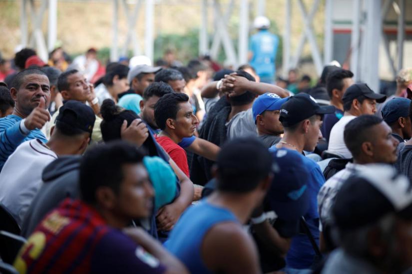 Migrants from Honduras, part of a new caravan from Central America trying to reach the United States, wait to be processed in an immigration facility in Ciudad Hidalgo, Mexico, January 17, 2019. REUTERS