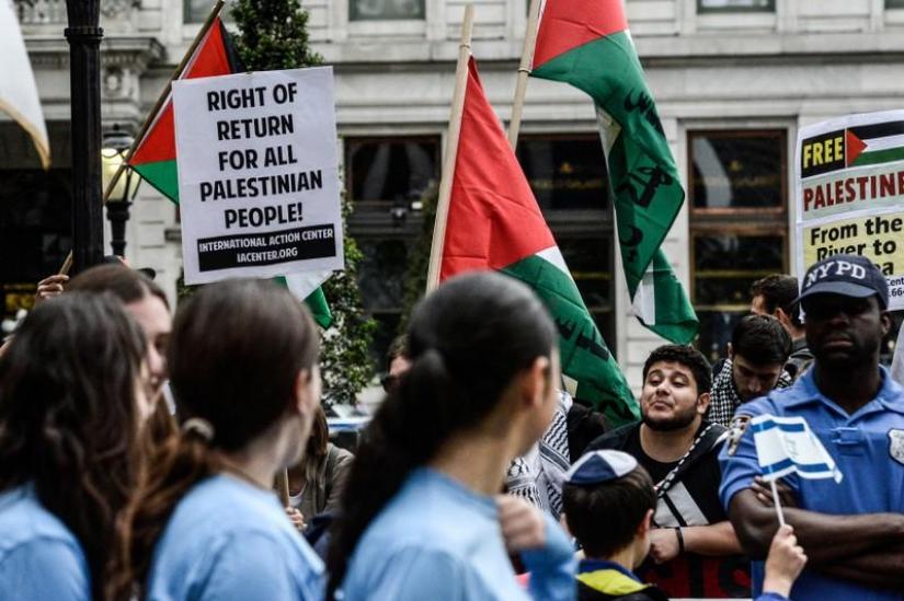 Activists protest at a `Celebrate Israel` parade in New York City, June 4, 2017. REUTERS