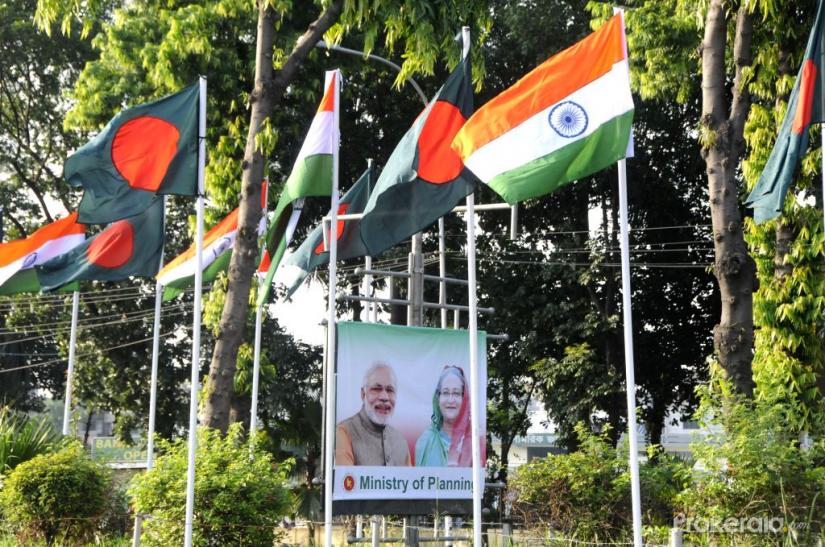 Photo taken on June 5, 2015 shows billboards of Indian Prime Minister Narendra Modi and Bangladeshi Prime Minister Sheikh Hasina in Dhaka, Bangladesh. File Photo