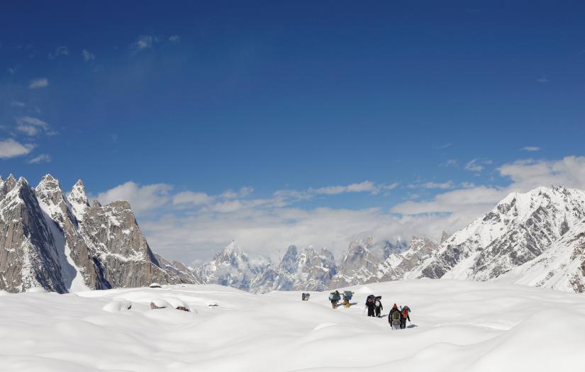 Trekkers and porters hike down the Baltoro glacier in the Karakoram mountain range in Pakistan September 7, 2014. REUTERS
