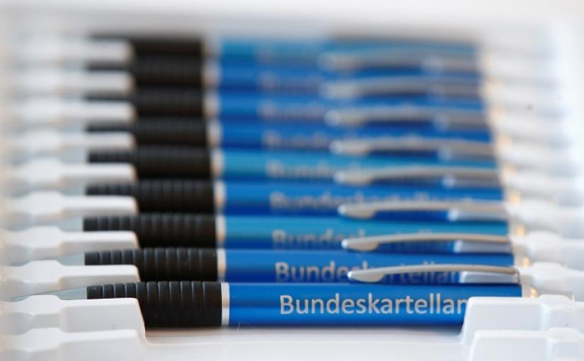 Pens with the logo of Germany`s Federal Cartel Office are pictured following a news conference in which the anti-trust watchdog presented its findings of the investigation into Facebook`s data collection practices in Bonn, Germany, February 7, 2019. REUTERS
